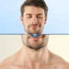 Split-face portrait: top half clean-shaven with blue background, bottom half bearded with beige background and a divider bar in the center labeled 'T'